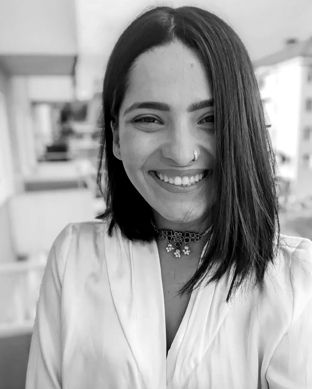 Black and white portrait of Saaniya smiling